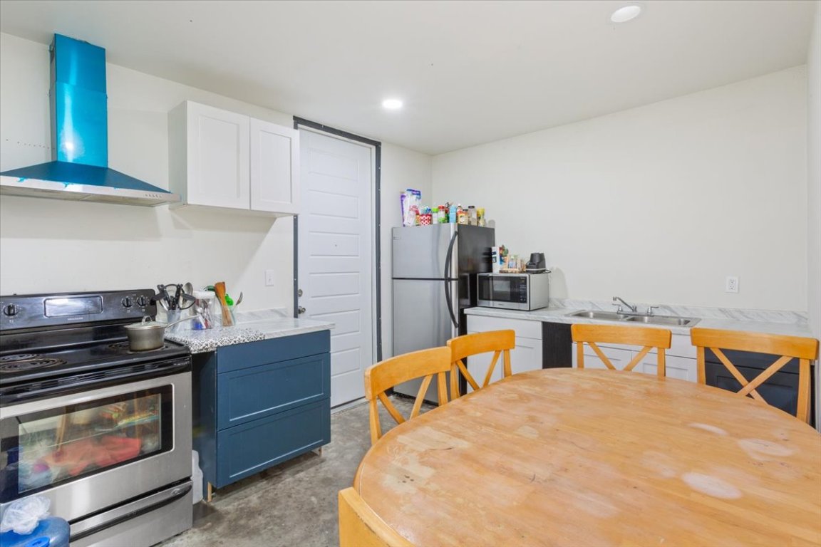 50 Dusty Dam Road Coupland, TX 78615 - Photo 28 of 38 The guest home includes a fully functional kitchen designed for independent living. Ample cabinetry and counter space make meal preparation easy and efficient.