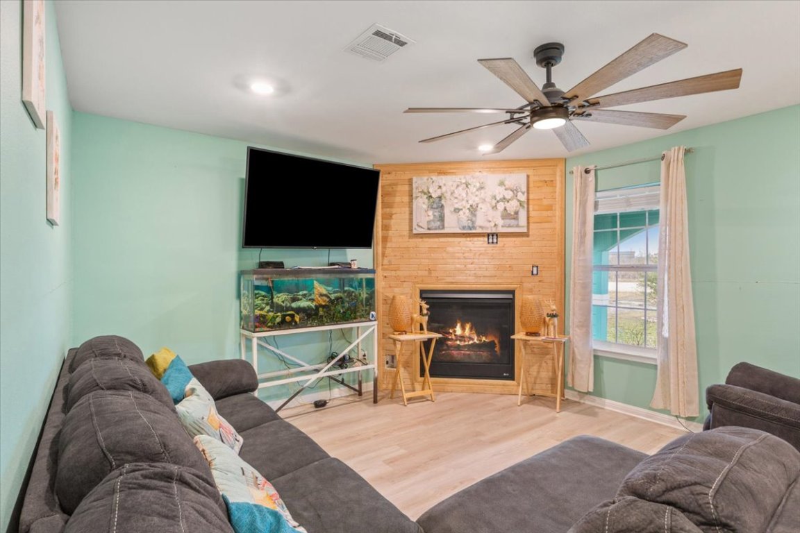 50 Dusty Dam Road Coupland, TX 78615 - Photo 8 of 38 Natural light fills the room, creating a bright and welcoming atmosphere.