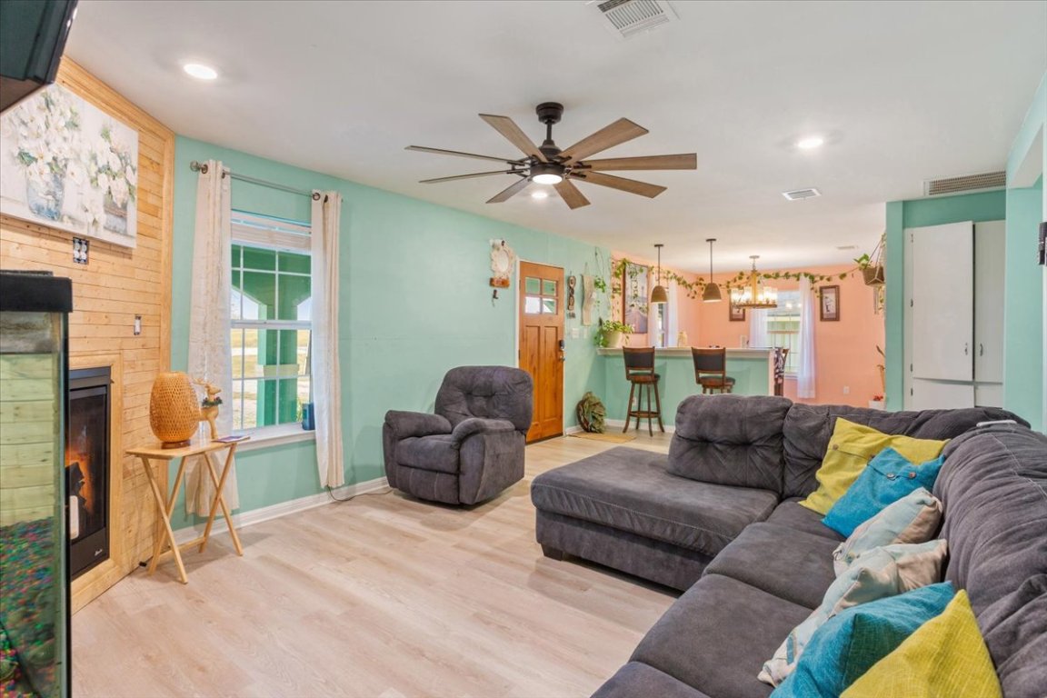 50 Dusty Dam Road Coupland, TX 78615 - Photo 10 of 38 This space is ideal for relaxing, entertaining, or gathering with family. It serves as the central hub of the main residence.