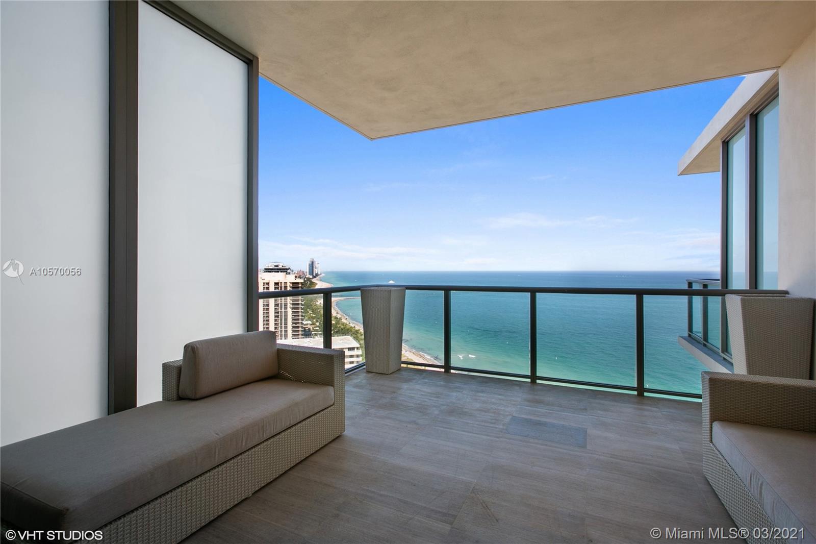 9703 Collins Avenue, Unit PH07 Bal Harbour, FL 33154 - Photo 2 of 23 a living room with furniture with a ceiling fan