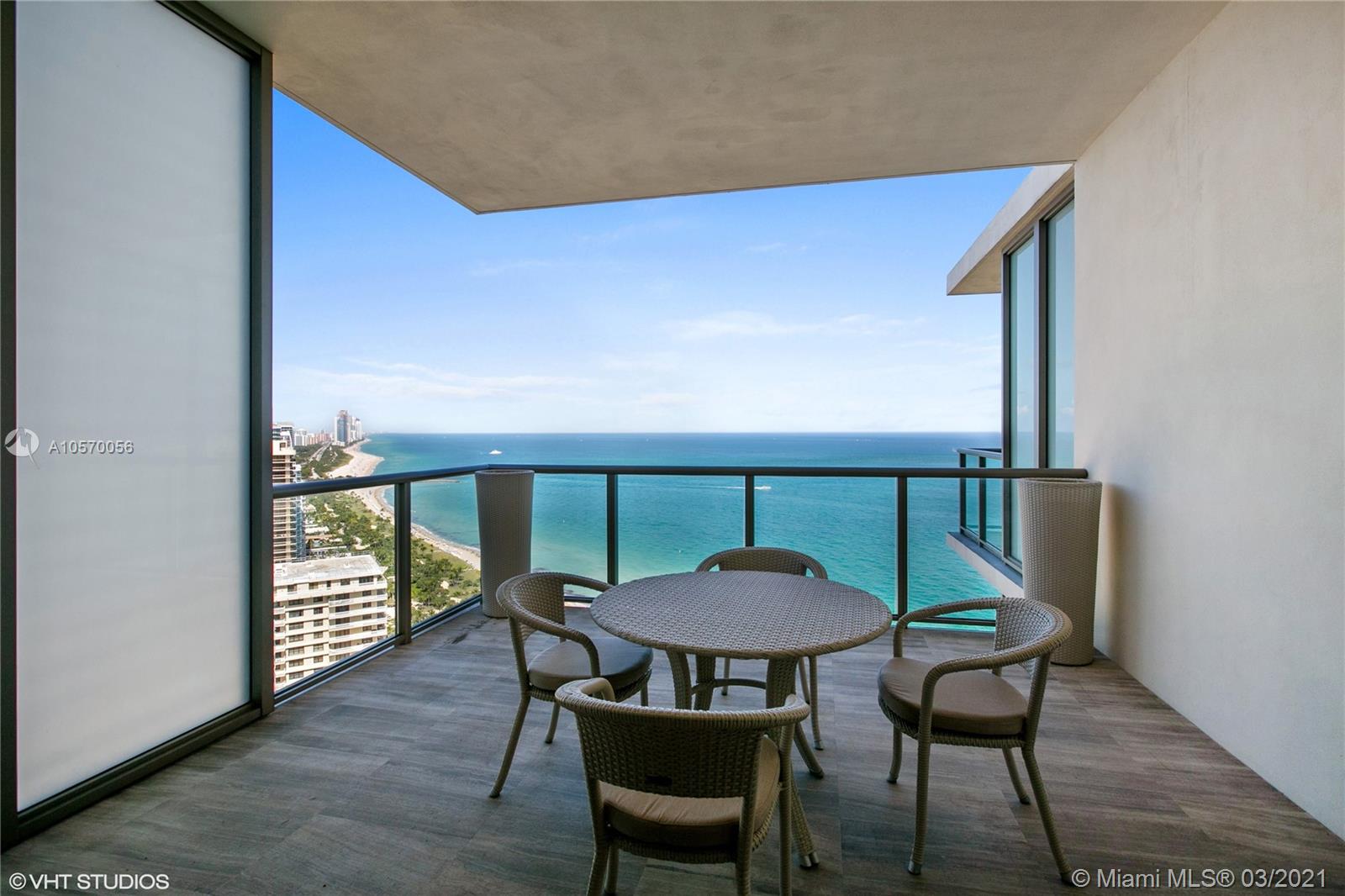9703 Collins Avenue, Unit PH07 Bal Harbour, FL 33154 - Photo 16 of 23 a view of a dining room with furniture window and wooden floor