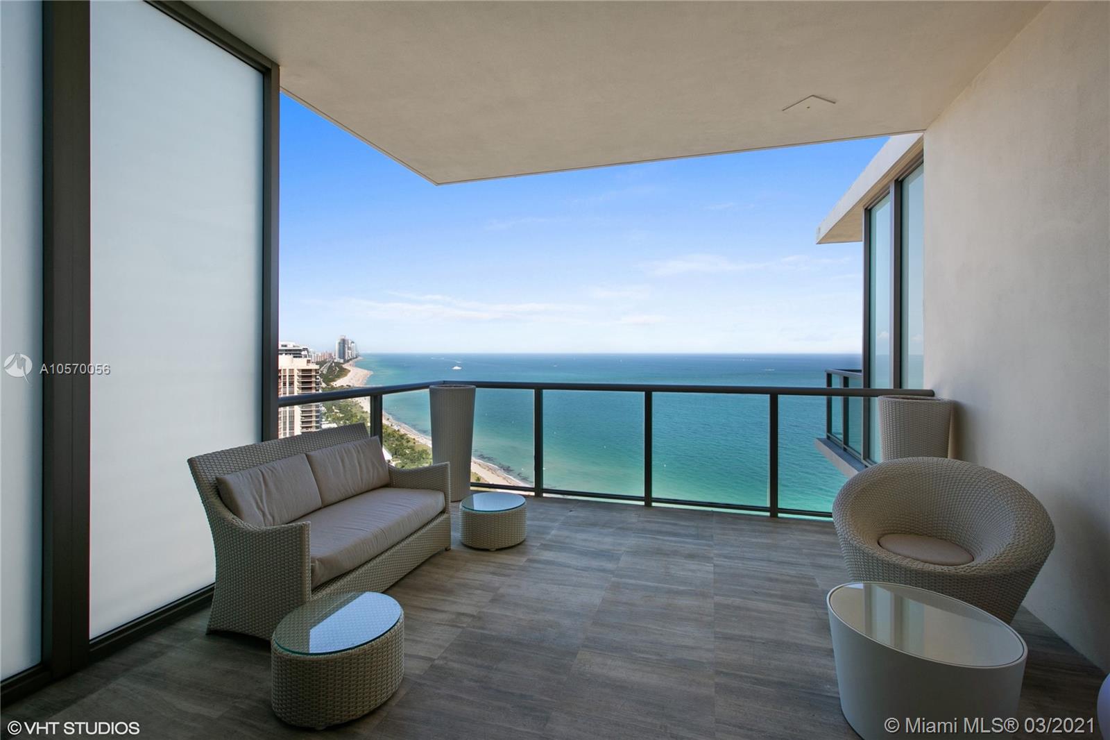 9703 Collins Avenue, Unit PH07 Bal Harbour, FL 33154 - Photo 17 of 23 a balcony with furniture and a potted plant