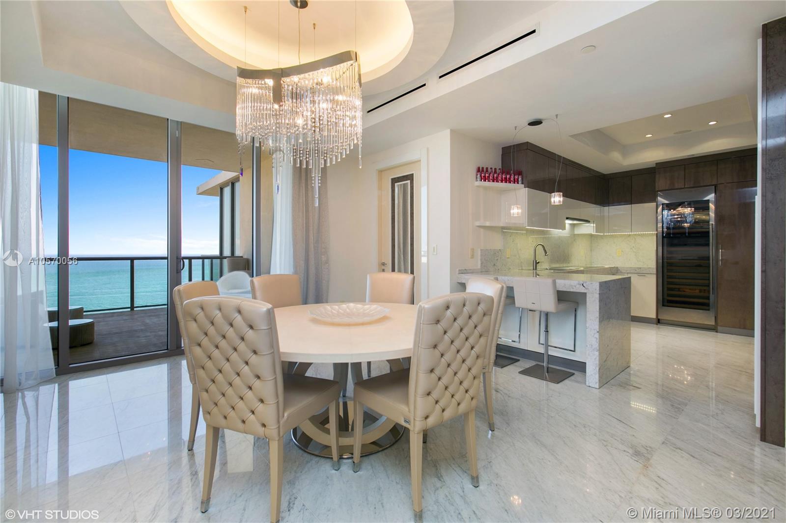 9703 Collins Avenue, Unit PH07 Bal Harbour, FL 33154 - Photo 3 of 23 a dining room with furniture and window