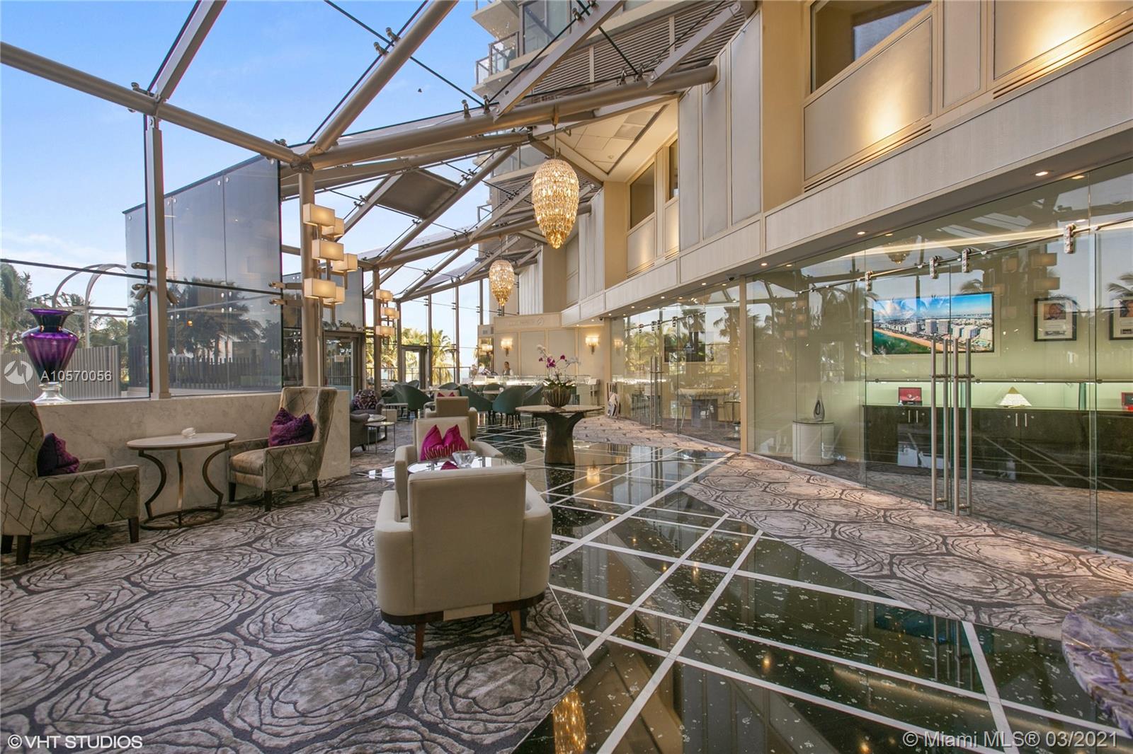 9703 Collins Avenue, Unit PH07 Bal Harbour, FL 33154 - Photo 21 of 23 a view of a chairs and table in the patio