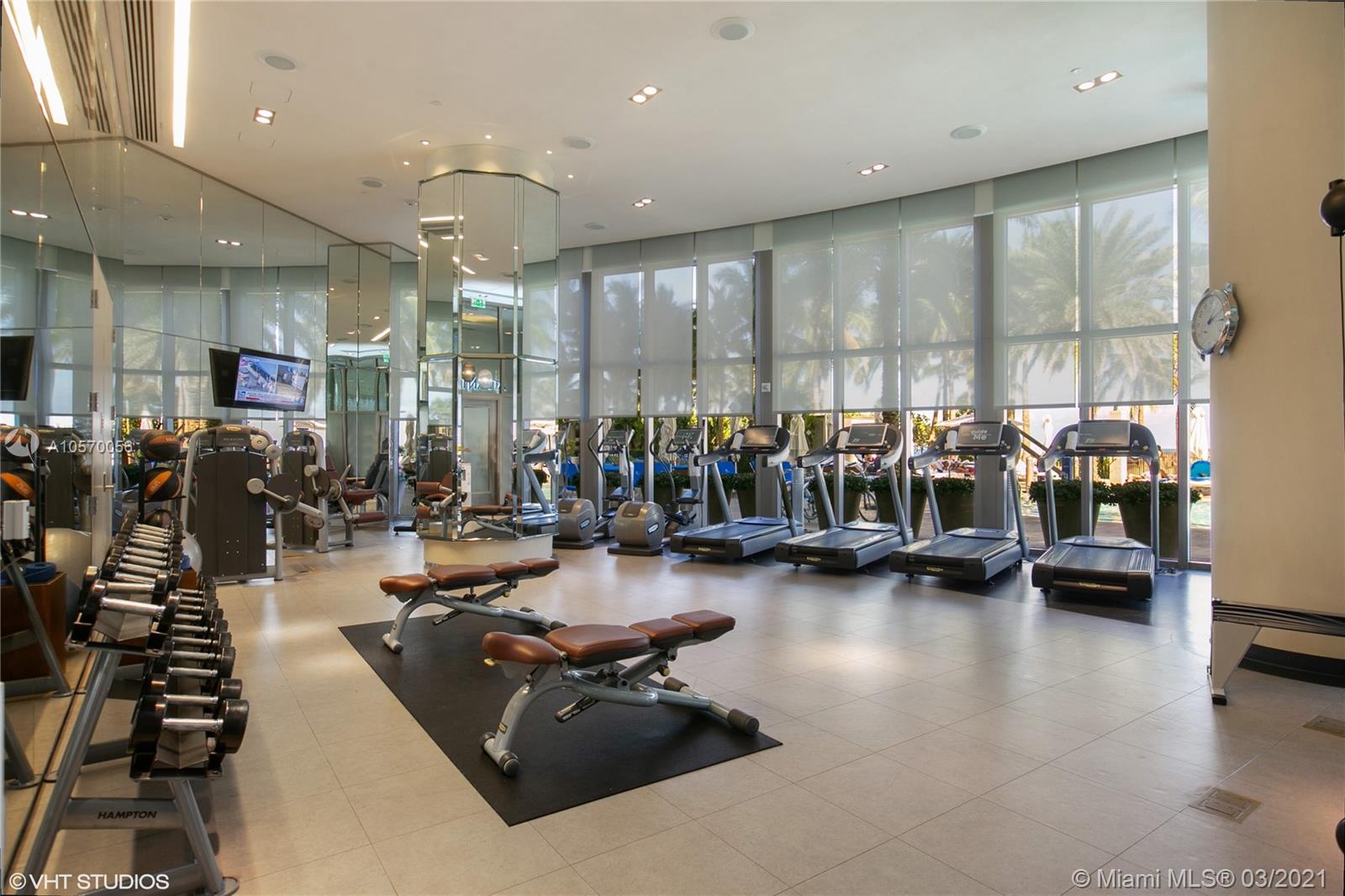 9703 Collins Avenue, Unit PH07 Bal Harbour, FL 33154 - Photo 23 of 23 a view of a room with gym equipment