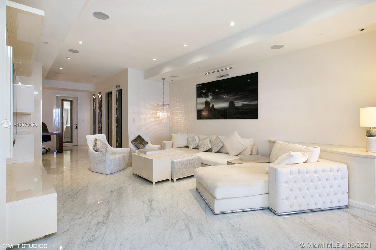 9703 Collins Avenue, Unit PH07 Bal Harbour, FL 33154 - Photo 4 of 23 a living room with furniture and a flat screen tv