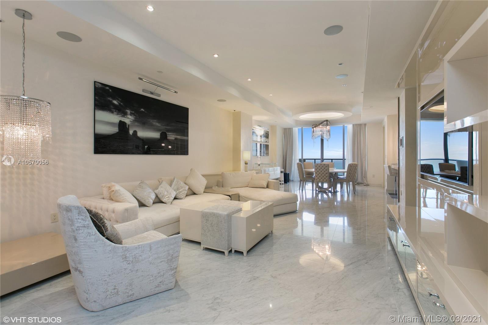 9703 Collins Avenue, Unit PH07 Bal Harbour, FL 33154 - Photo 5 of 23 a living room with furniture and a flat screen tv
