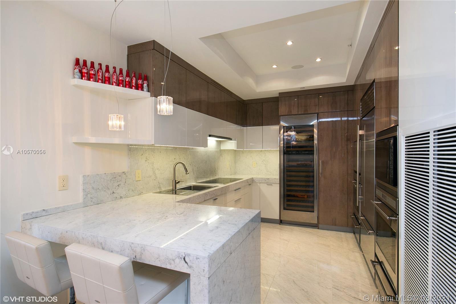 9703 Collins Avenue, Unit PH07 Bal Harbour, FL 33154 - Photo 6 of 23 a kitchen with a sink and a refrigerator