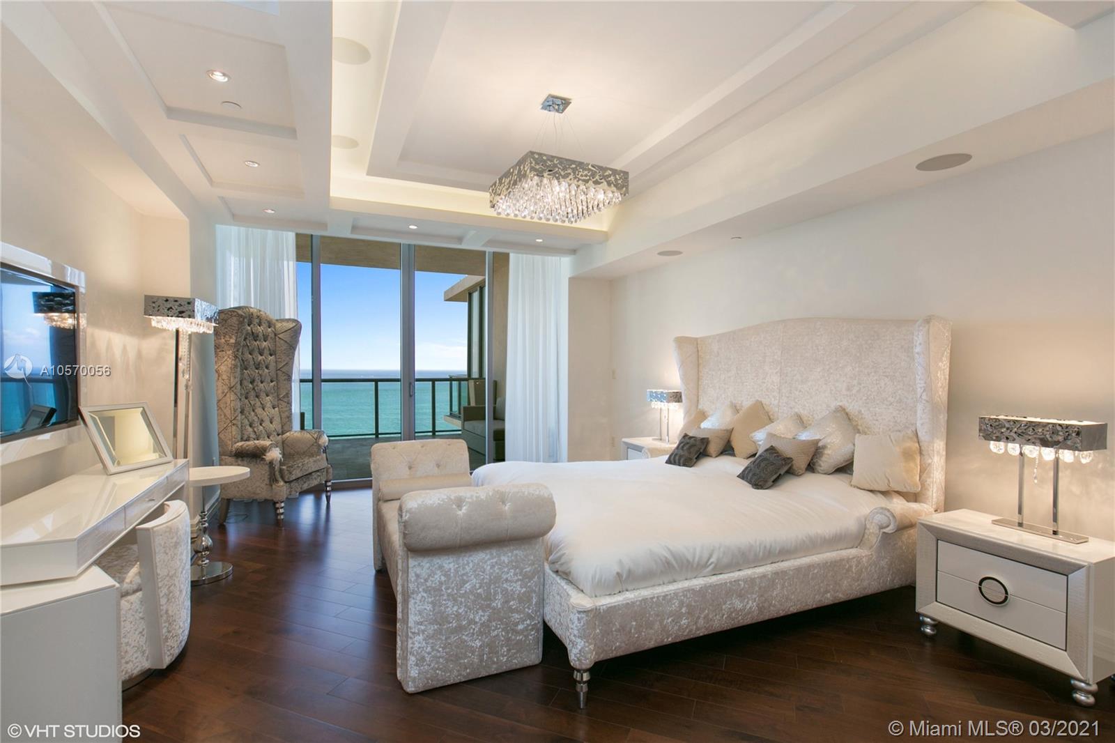 9703 Collins Avenue, Unit PH07 Bal Harbour, FL 33154 - Photo 9 of 23 a bedroom with furniture and a large window