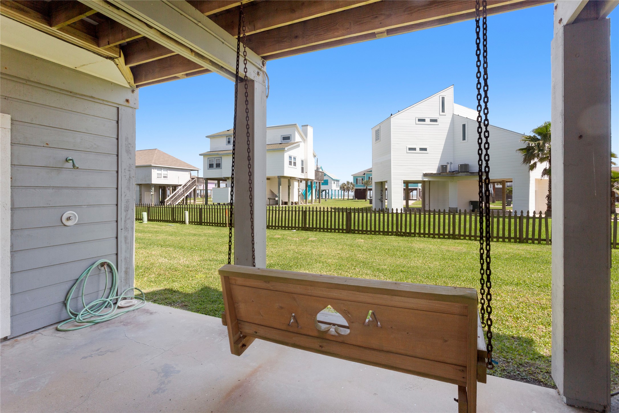 17627 Termini-San Luis Pass Road Galveston, TX 77554 - Photo 21 of 28 Sit for a while and enjoy the Gulf breezes. Outdoor shower w/new fixtures and private storage to the left.