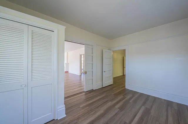 a view of wooden floor in an empty room