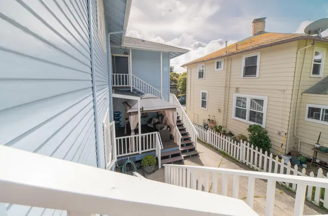 a view of balcony with wooden floor