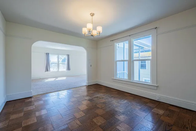 a view of an empty room with closet area
