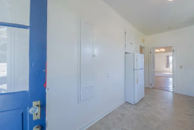 a bathroom with a bathtub sink a window and mirror