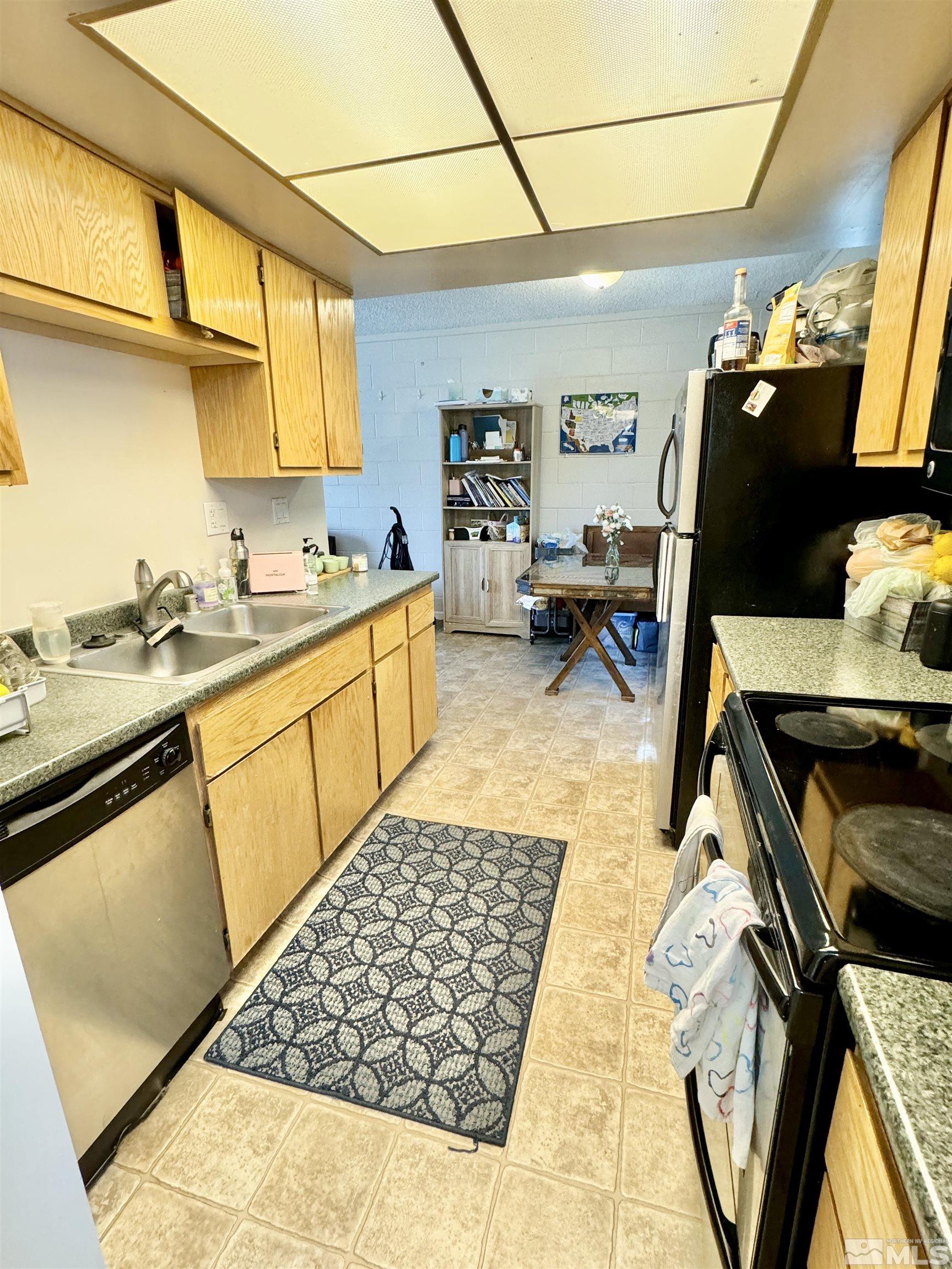3915 Covington Way Reno, NV 89503 - Photo 8 of 17 a kitchen with a sink appliances and cabinets