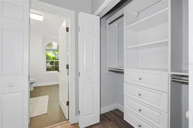 a white bath tub sitting next to a white sink