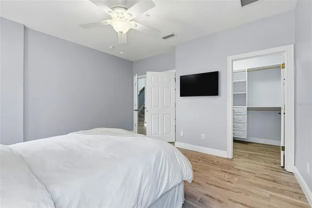 a bathroom with a granite countertop sink mirror and window