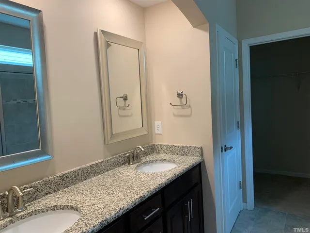 a bathroom with a glass shower door