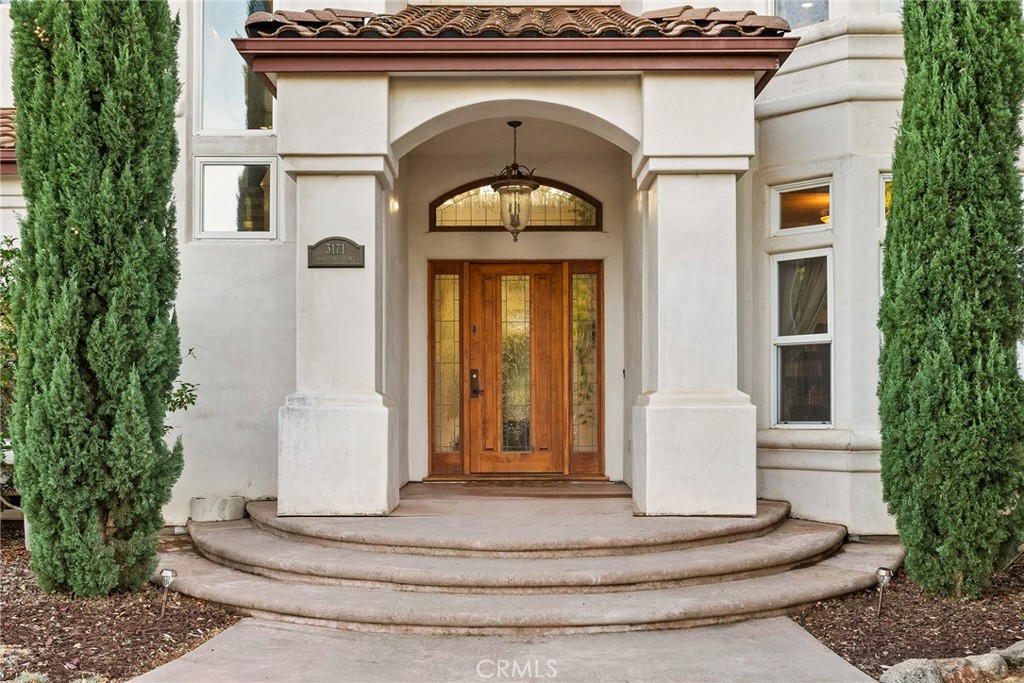 3171 Sandstone Lane Chico, CA 95928 - Photo 14 of 70 a front view of a house with a white door