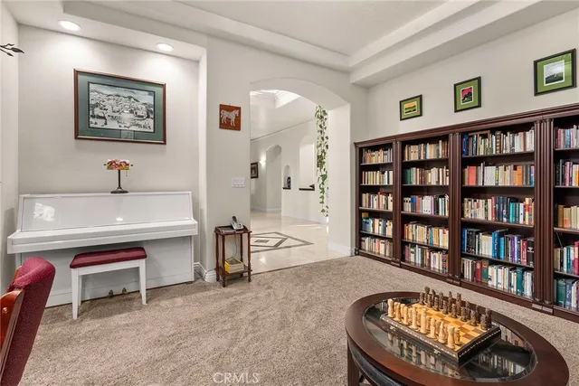 a room with stainless steel appliances granite countertop a sink and a stove