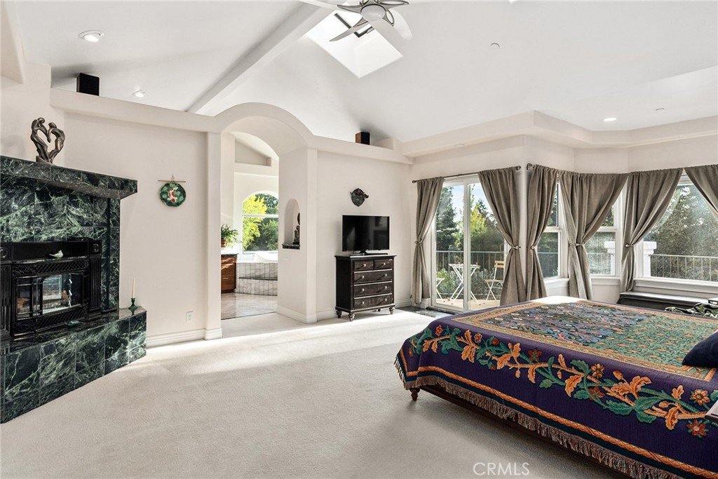 3171 Sandstone Lane Chico, CA 95928 - Photo 33 of 70 a living room with furniture a flat screen tv and a fireplace