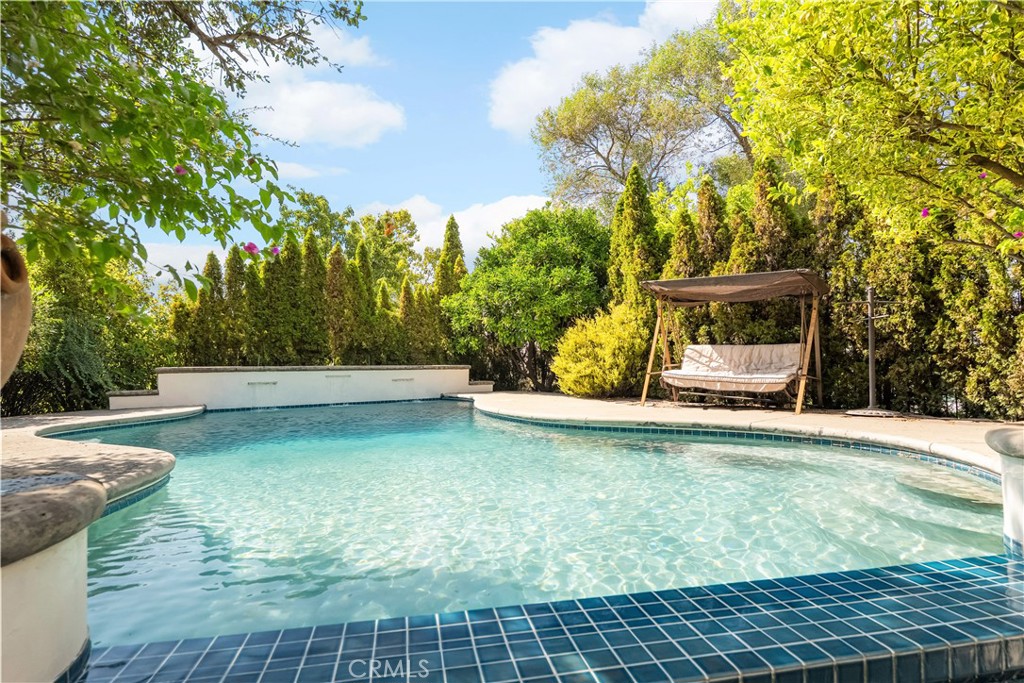 3171 Sandstone Lane Chico, CA 95928 - Photo 48 of 70 a view of a swimming pool with an outdoor space and seating area