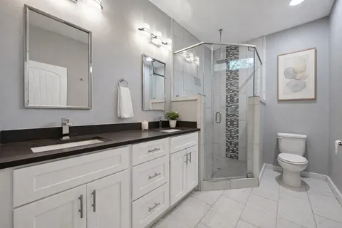 a bedroom with bed and a window