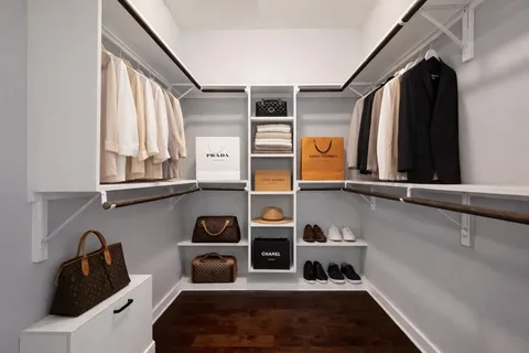 a bedroom with bed and window