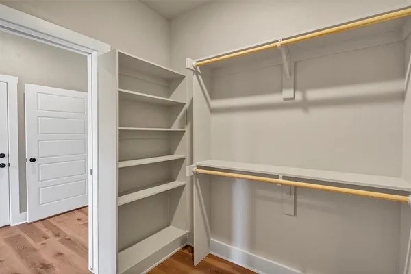 a view of an empty walk in closet
