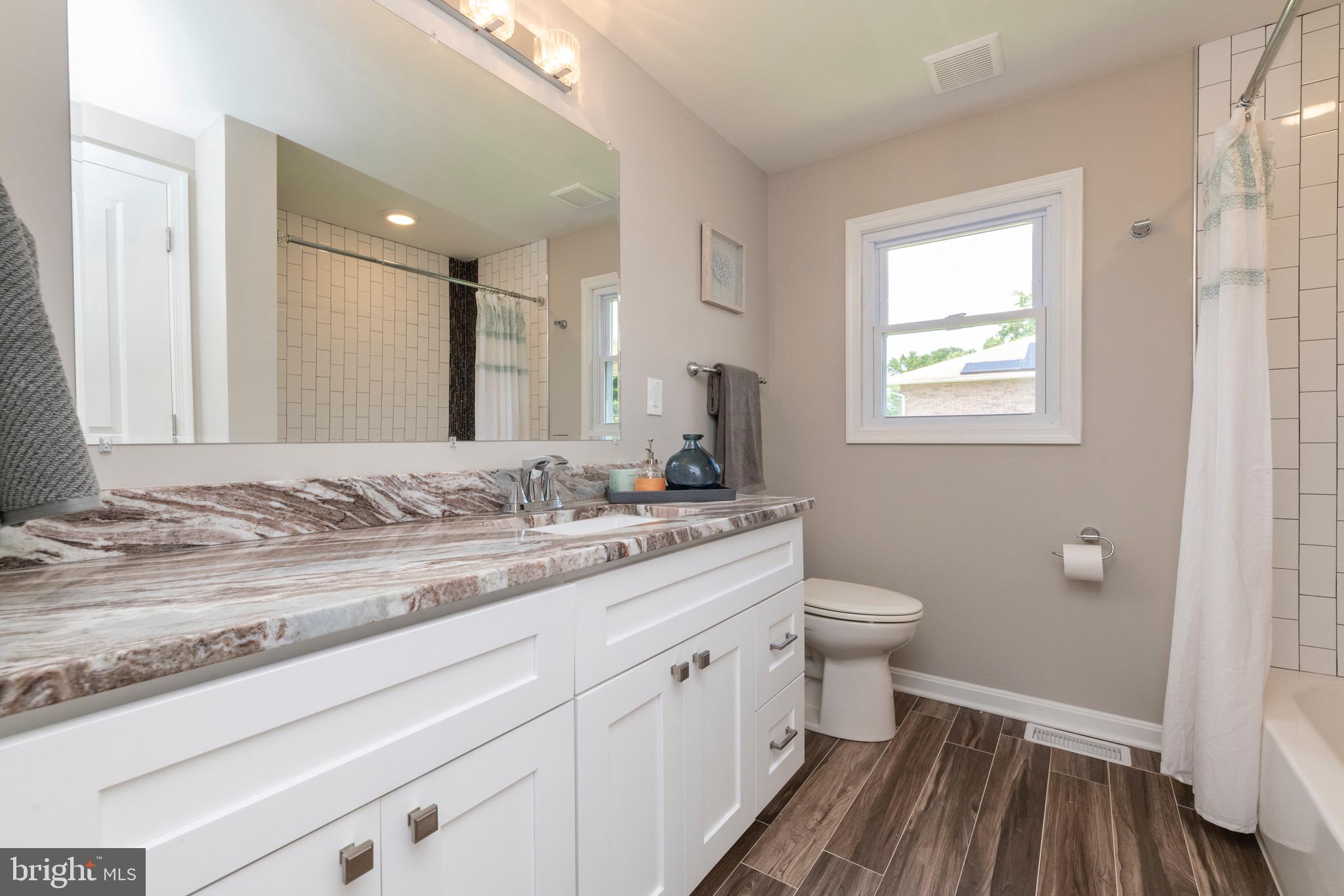 524 Patapsco Avenue Rosedale, MD 21237 - Photo 24 of 46 Hall bath with custom vanity and ceramic tile.