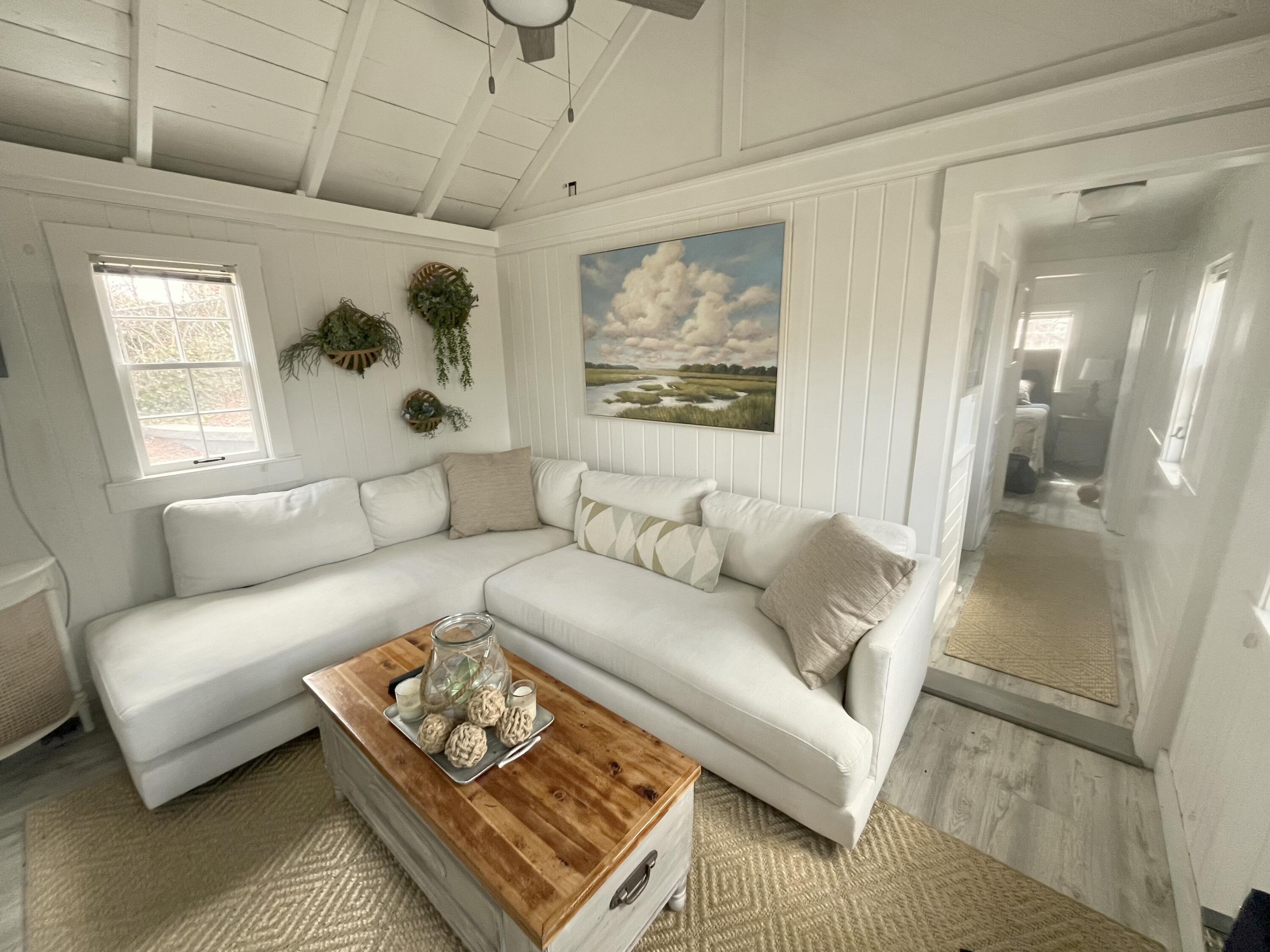 241 Old Wharf Road, Unit 162 Dennis Port, MA 02639 - Photo 11 of 28 a living room with furniture and a rug