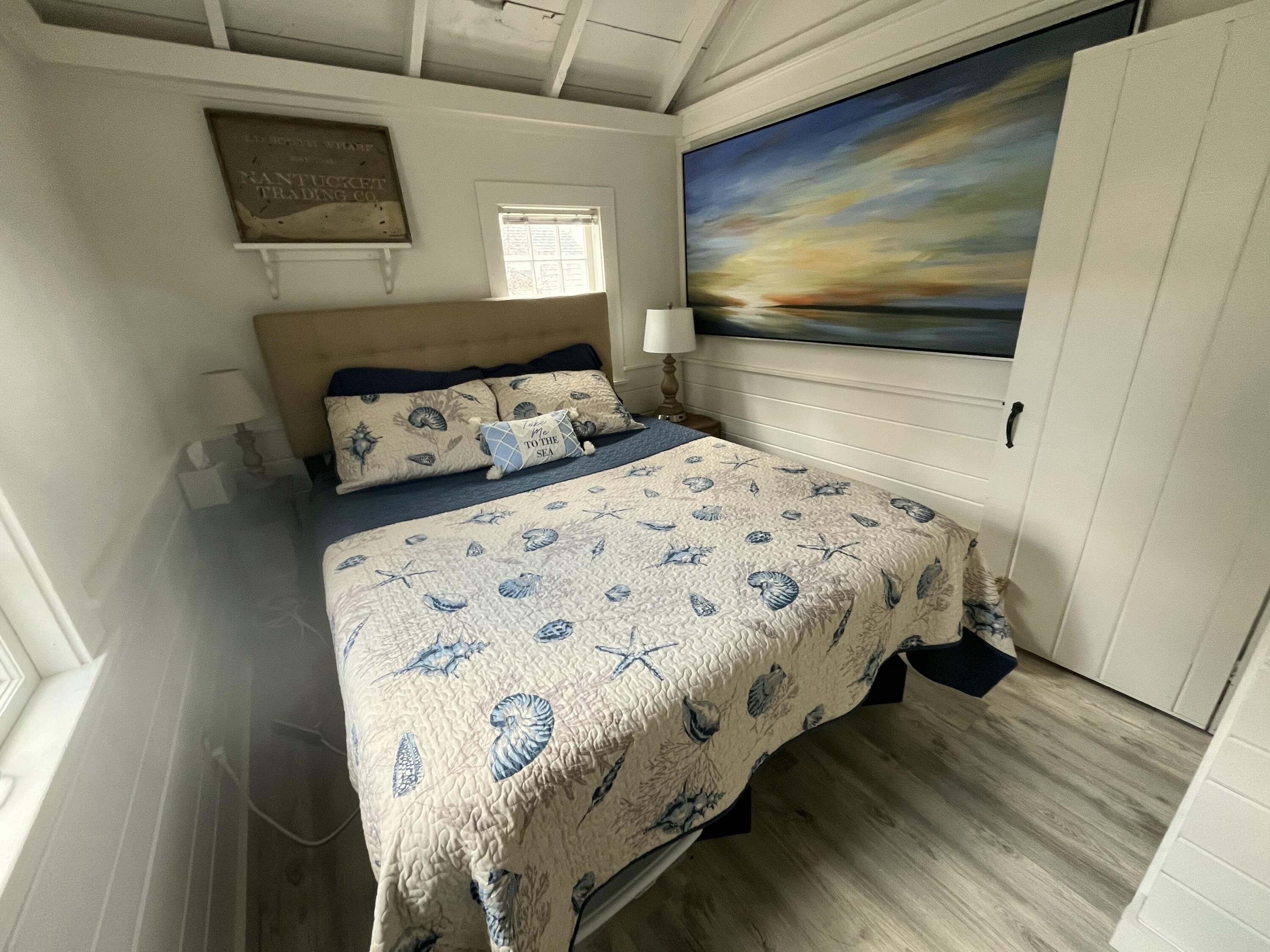 241 Old Wharf Road, Unit 162 Dennis Port, MA 02639 - Photo 13 of 28 a bedroom with a bed and flat screen tv