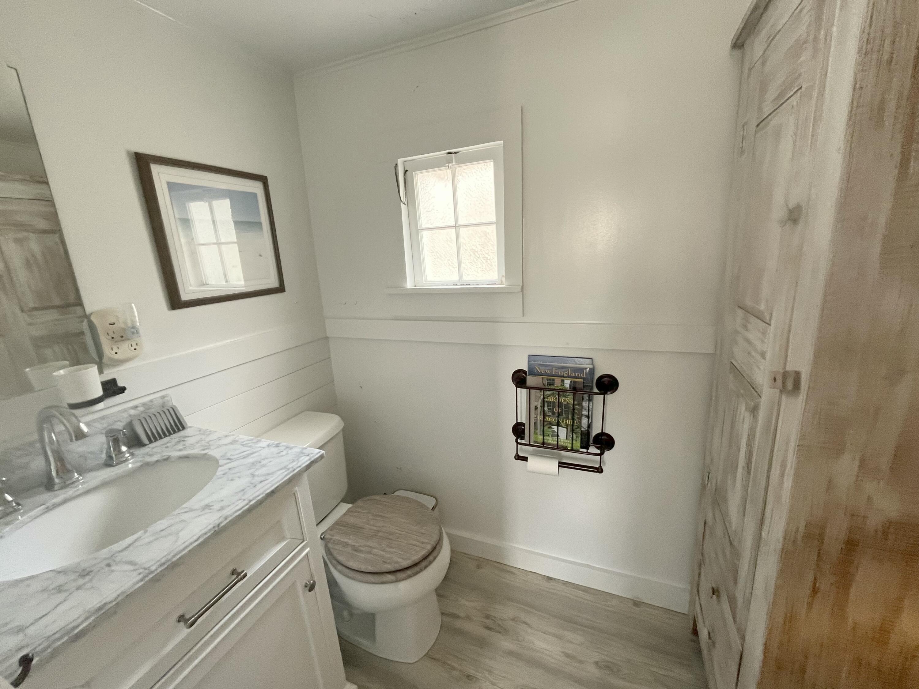 241 Old Wharf Road, Unit 162 Dennis Port, MA 02639 - Photo 16 of 28 a bathroom with a granite countertop toilet sink and mirror