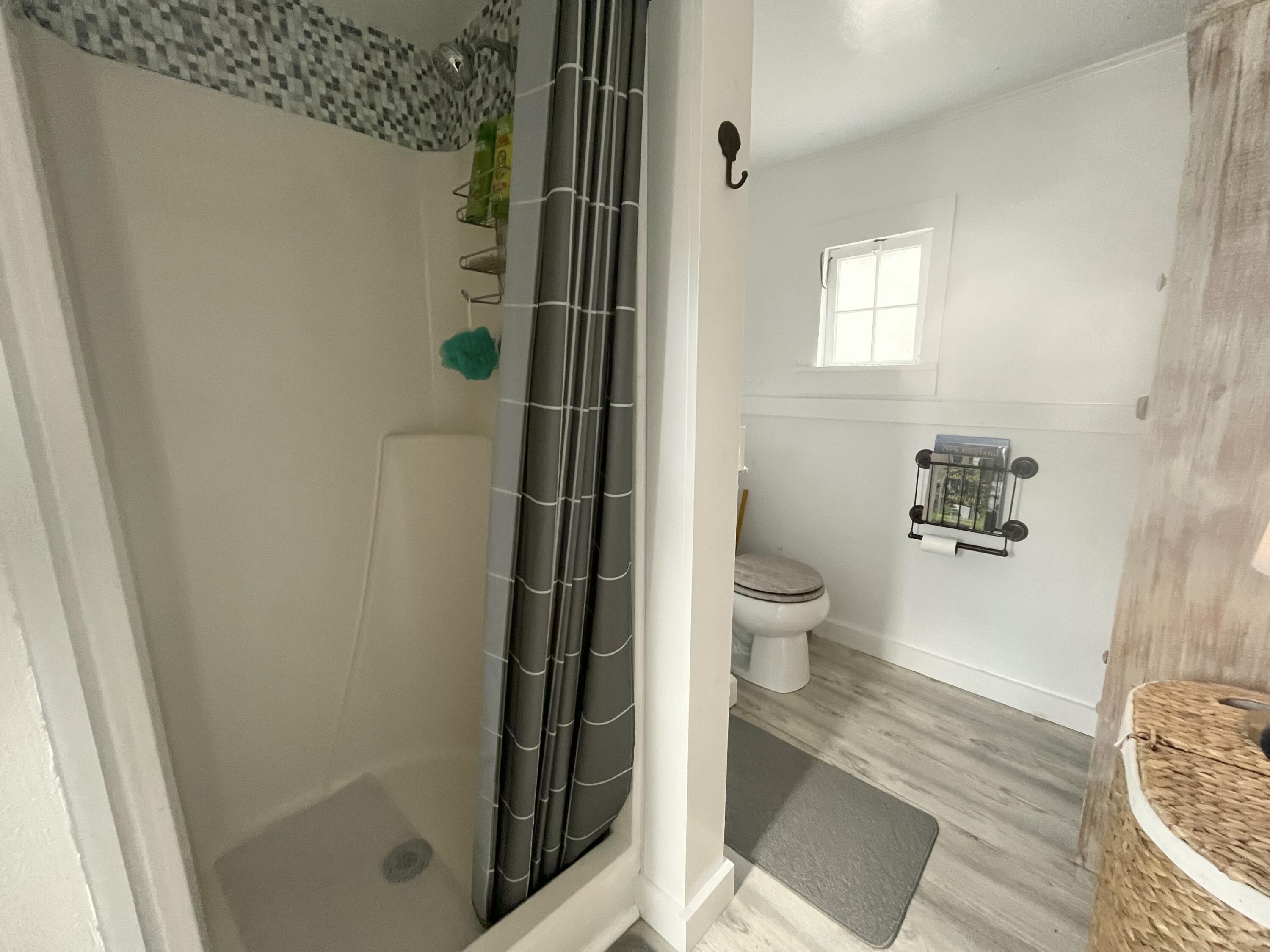 241 Old Wharf Road, Unit 162 Dennis Port, MA 02639 - Photo 17 of 28 a bathroom with a toilet and a shower