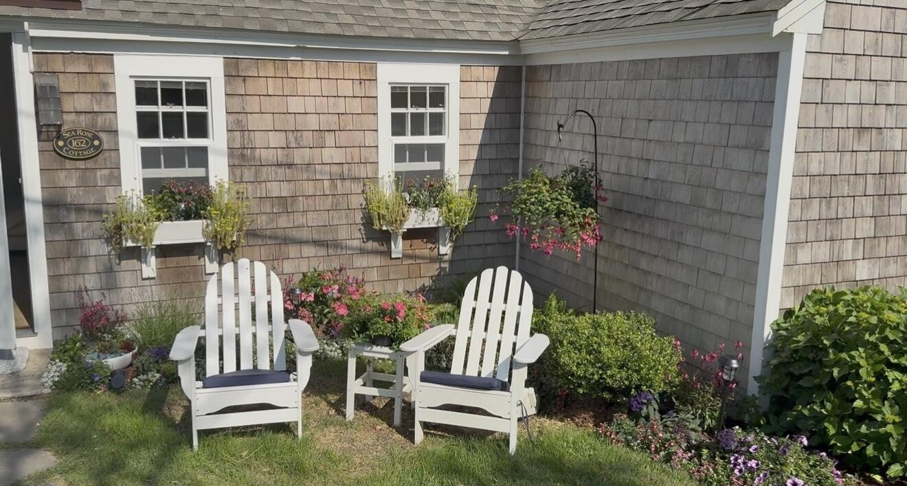 241 Old Wharf Road, Unit 162 Dennis Port, MA 02639 - Photo 2 of 28 a front view of a house with a garden