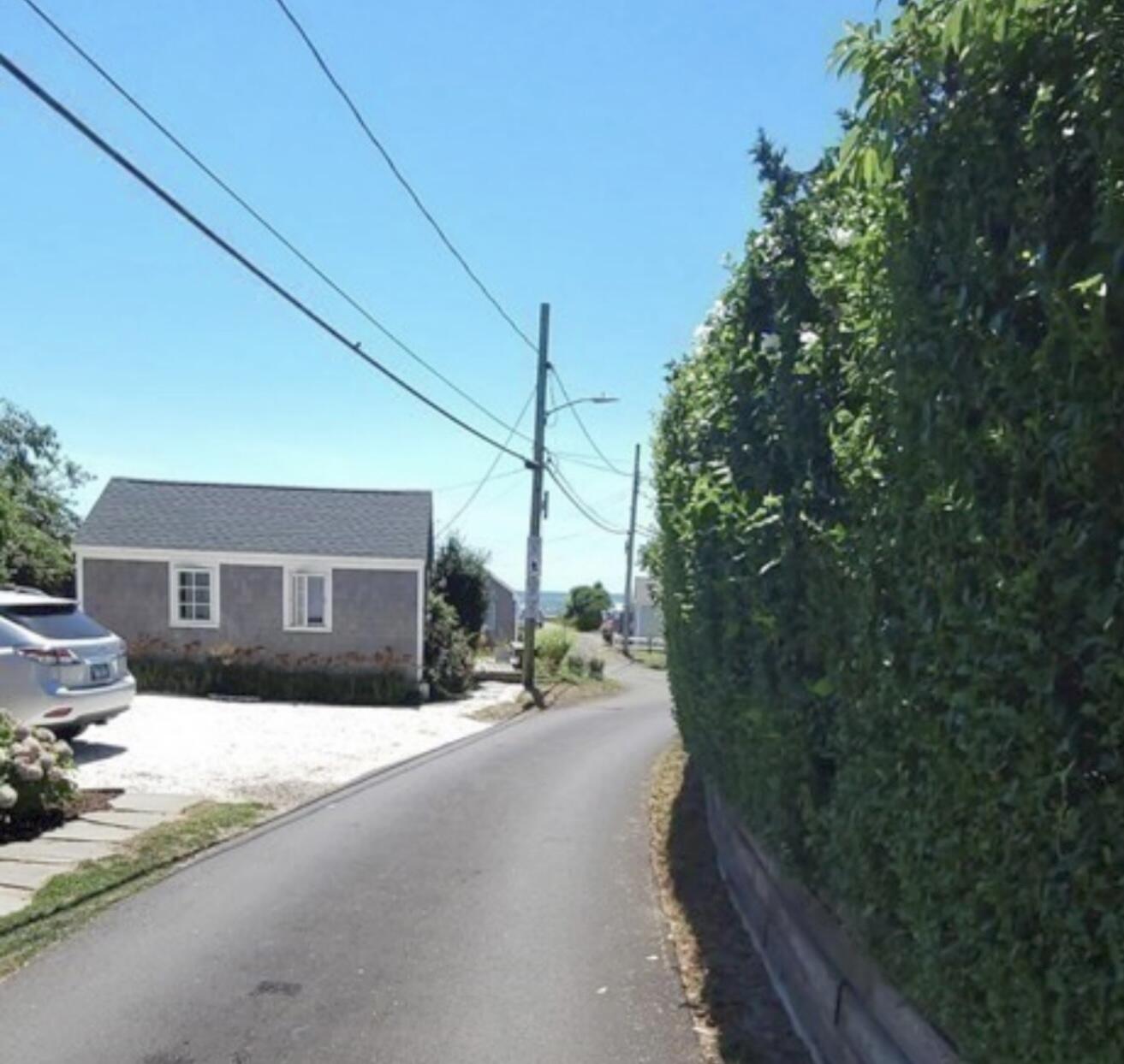 241 Old Wharf Road, Unit 162 Dennis Port, MA 02639 - Photo 24 of 28 a view of a house with a patio