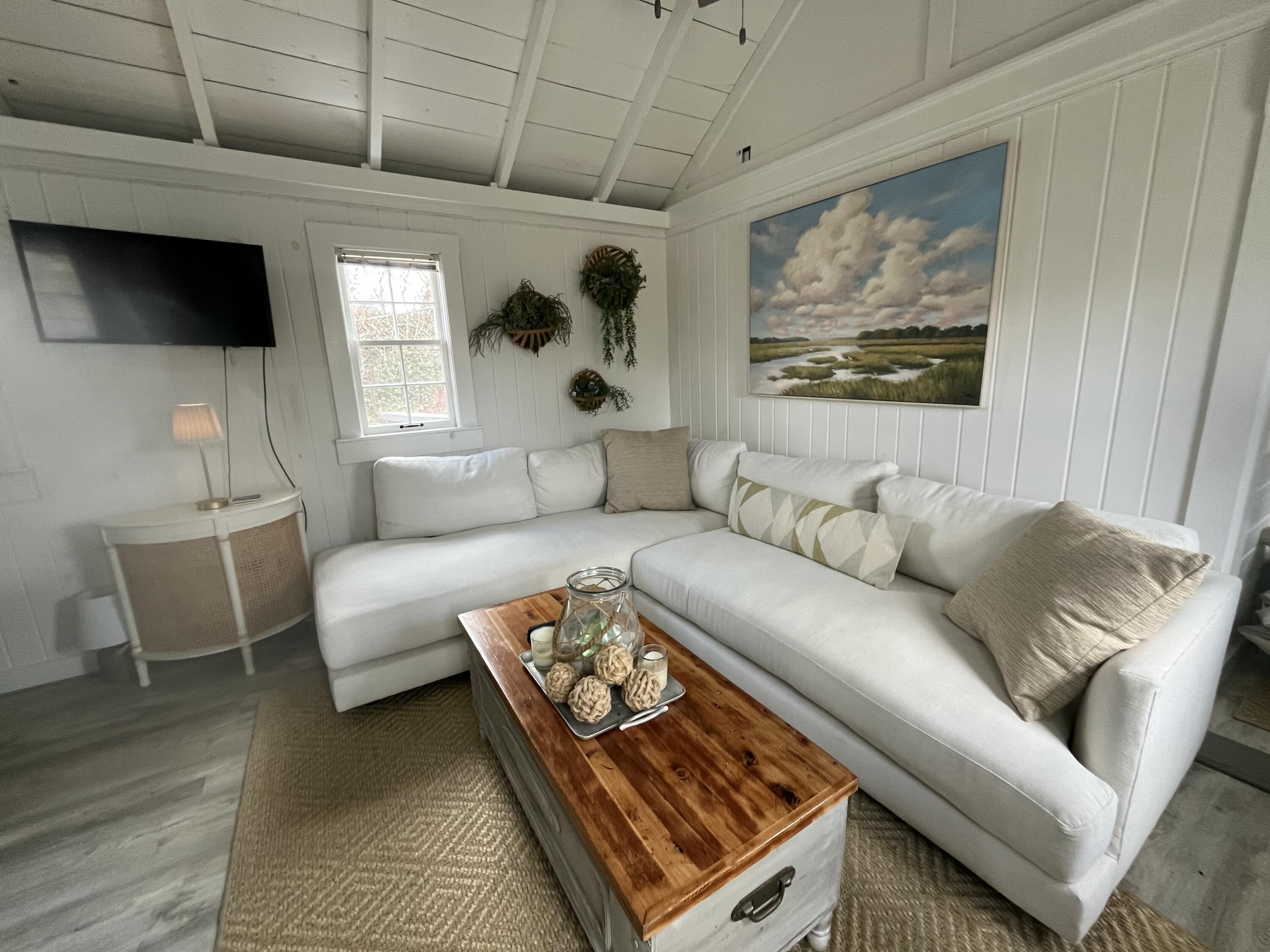 241 Old Wharf Road, Unit 162 Dennis Port, MA 02639 - Photo 5 of 28 a living room with furniture and a flat screen tv