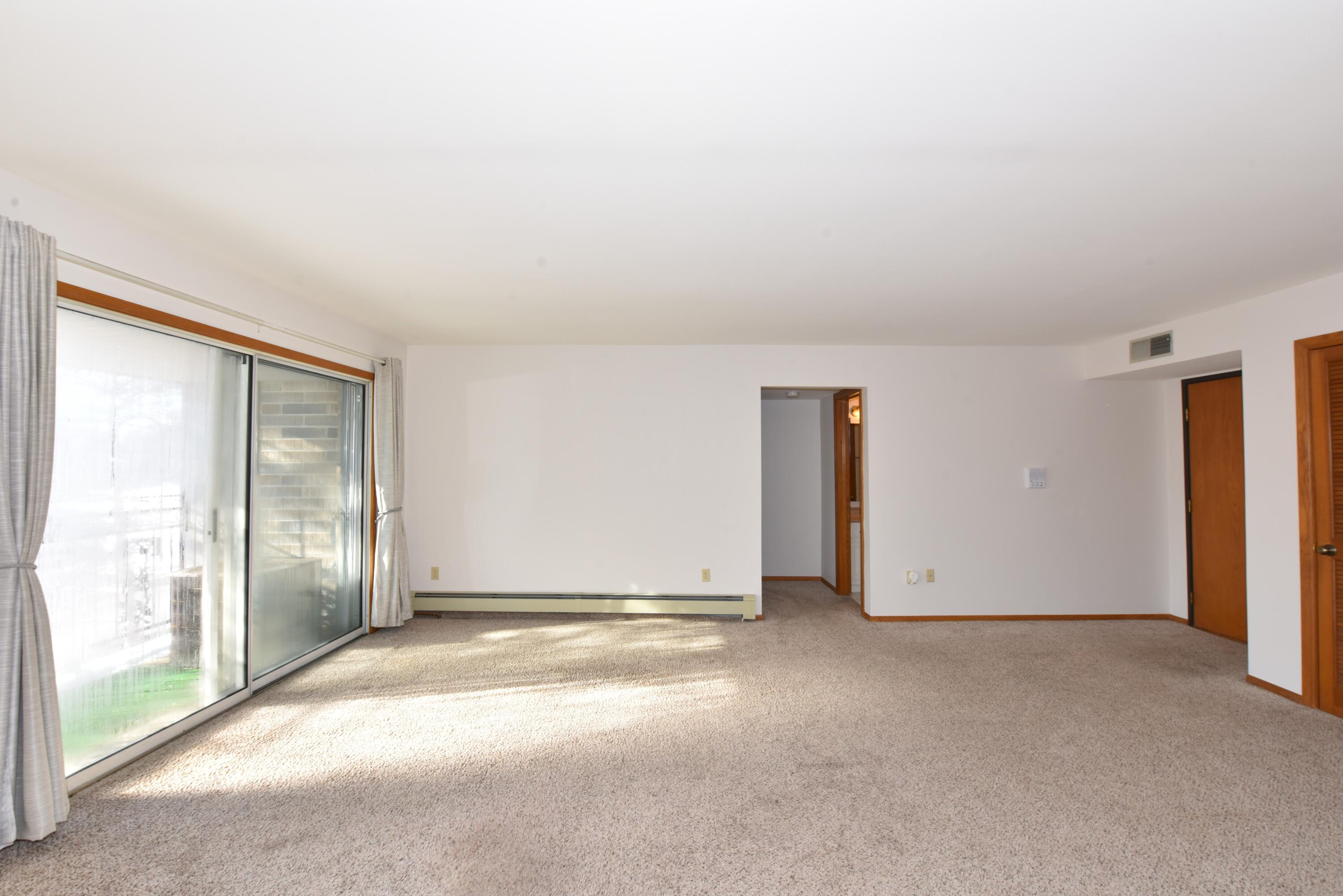 1730 West Green Tree Road, Unit 310 Glendale, WI 53209 - Photo 2 of 34 Private Balcony w Sliding Doors