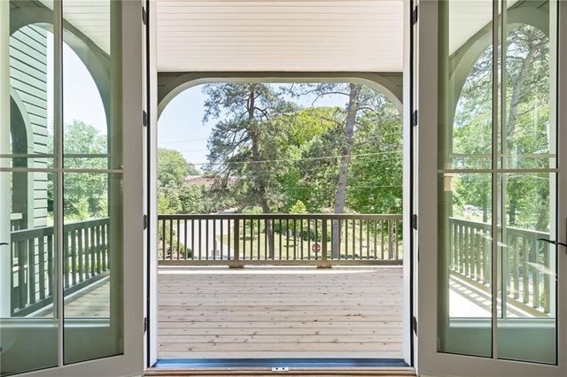 a view of a porch with a floor to ceiling window