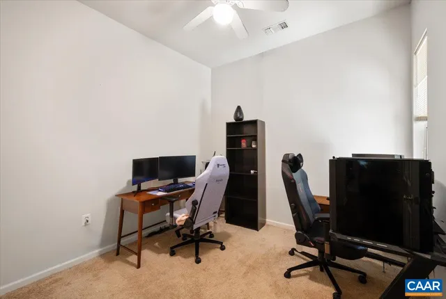 a view of a workspace with furniture
