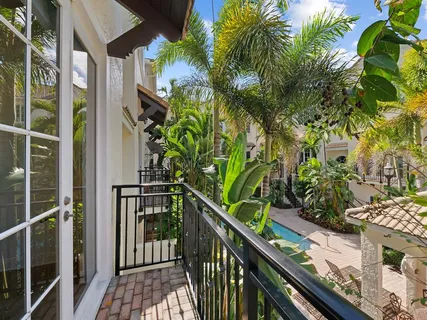 a view of balcony with wooden floor
