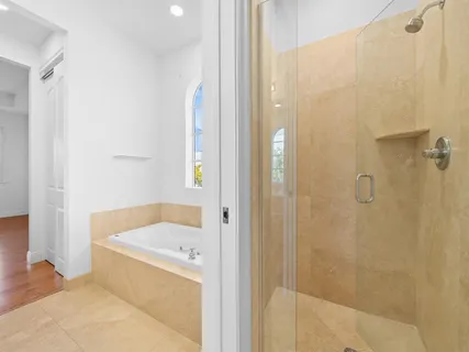 a bathroom with a tub and shower