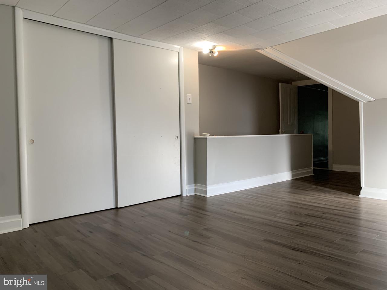 512 3rd Street, Unit 2 East Greenville, PA 18041 - Photo 11 of 11 a view of an empty room with wooden floor