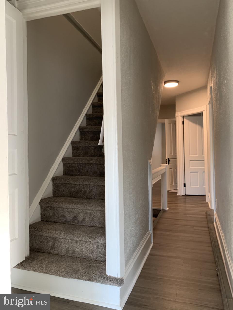 512 3rd Street, Unit 2 East Greenville, PA 18041 - Photo 8 of 11 a view of a hallway with wooden floor and entryway