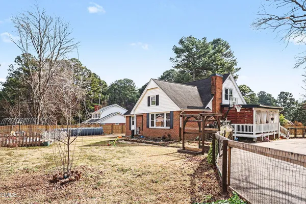 a front view of a house with a wooden fence