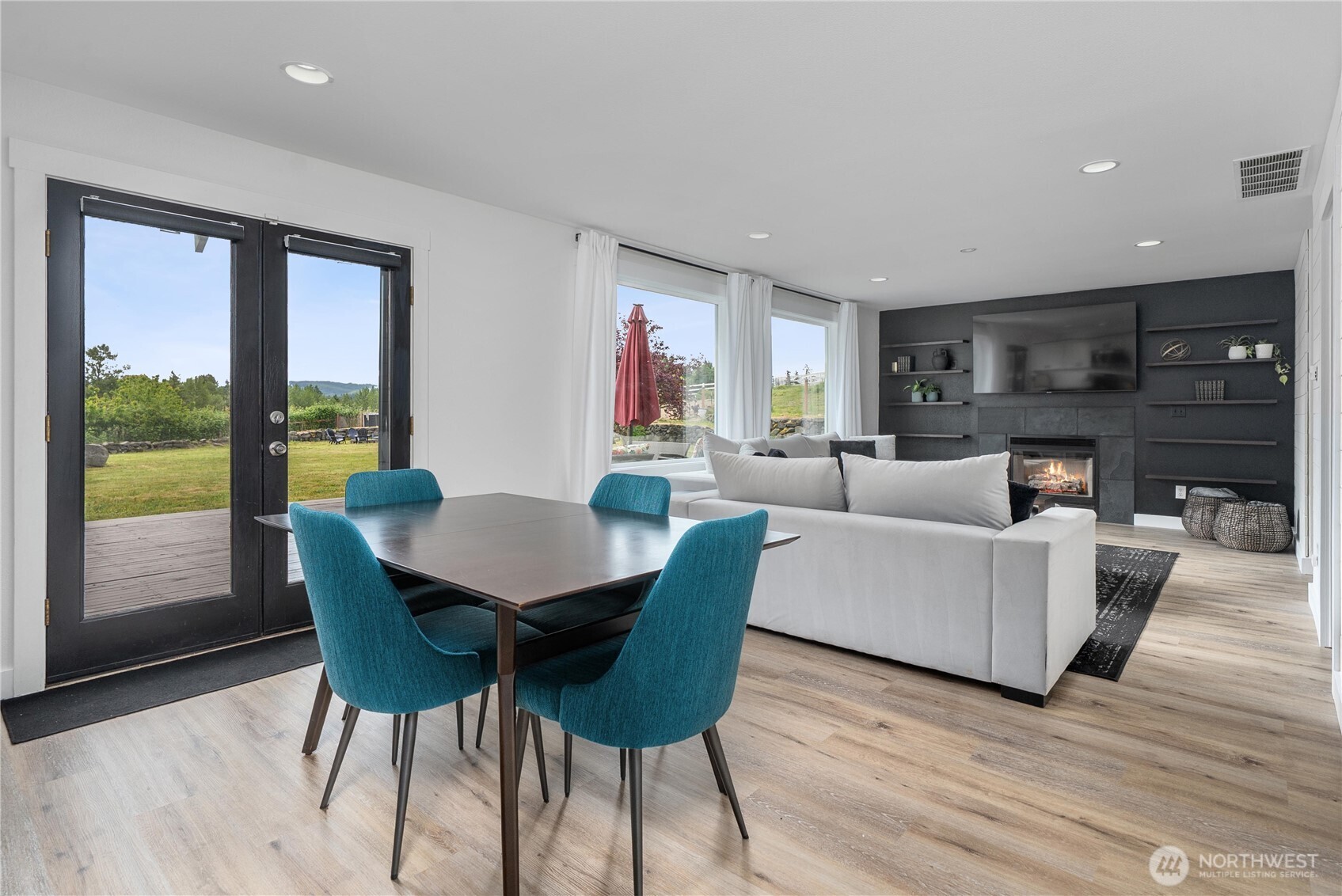 9906 328th Street East Graham, WA 98338 - Photo 13 of 38 a living room with furniture and a large window