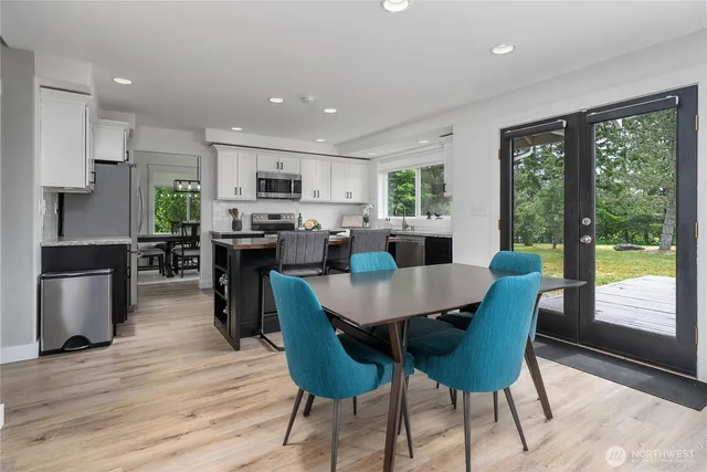 a view of a dining room with furniture window and wooden floor