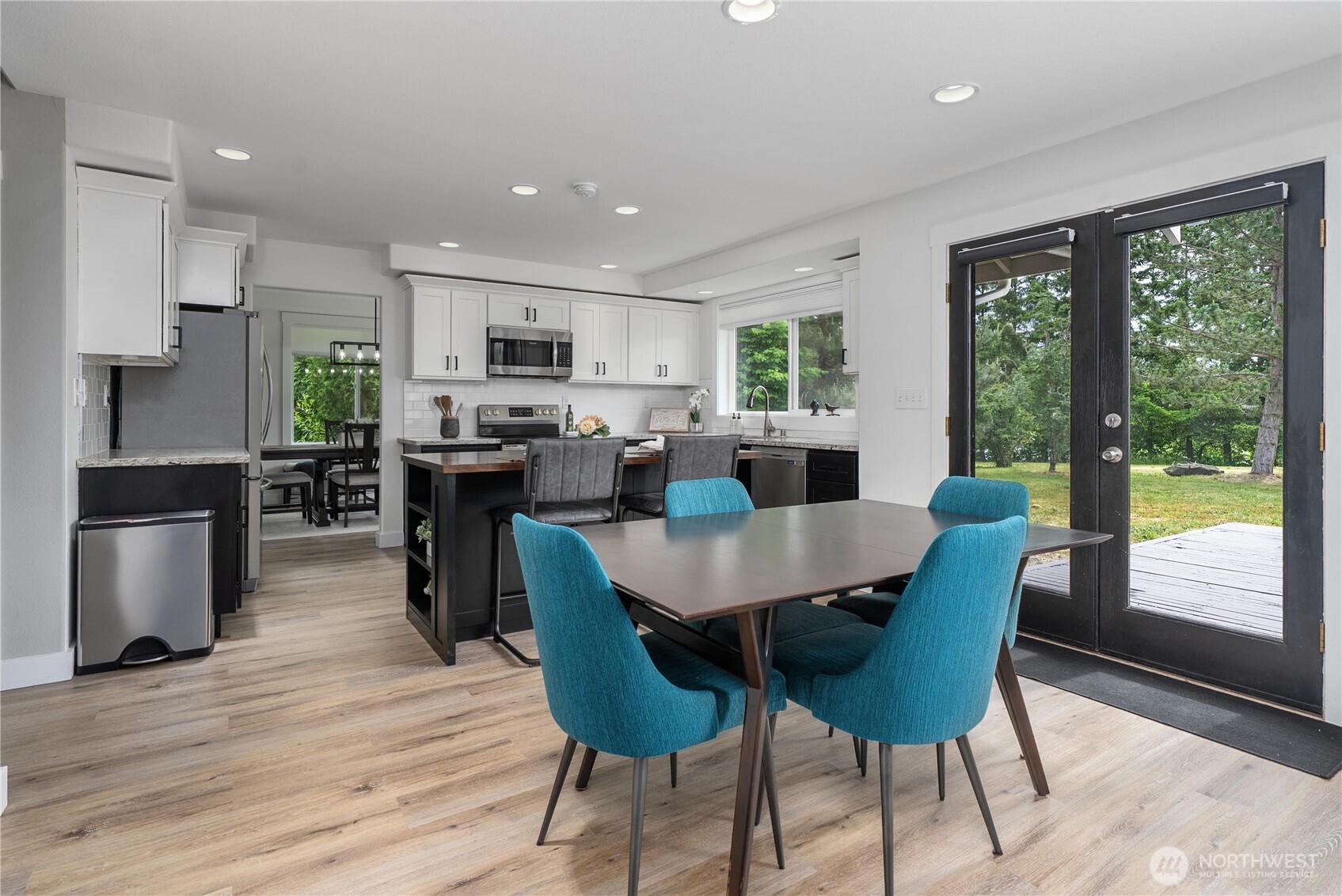 9906 328th Street East Graham, WA 98338 - Photo 6 of 38 a view of a dining room with furniture window and wooden floor