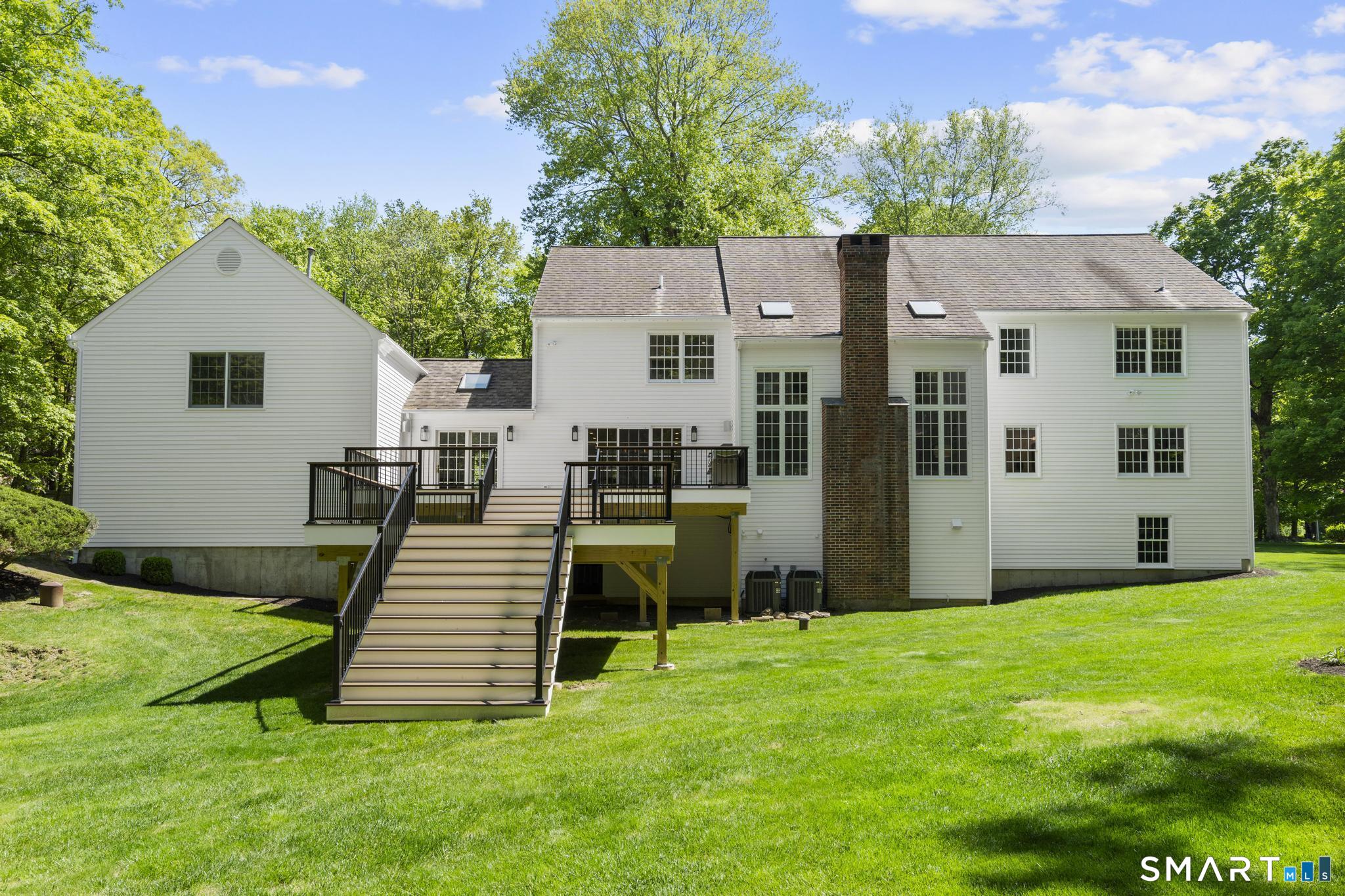 181 Old Branchville Road Ridgefield, CT 06877 - Photo 4 of 40 a view of a house with backyard