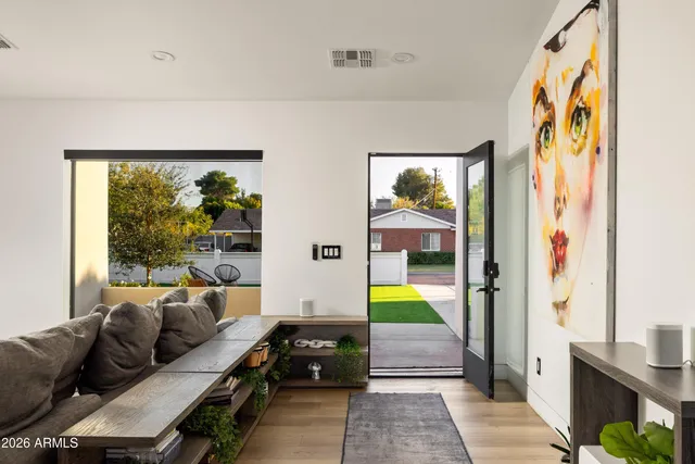 a living room with furniture and a large window